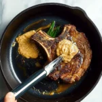 Cooked Cowboy Butter Steak topped with herb-infused butter for enhanced flavor