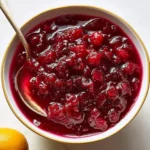 Bowl of homemade cranberry sauce with fresh cranberries and spices