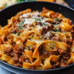 Delicious One Pot Short Rib Bolognese served in a bowl with fresh herbs