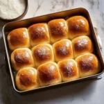 Fluffy homemade Thanksgiving rolls on a festive table setting.