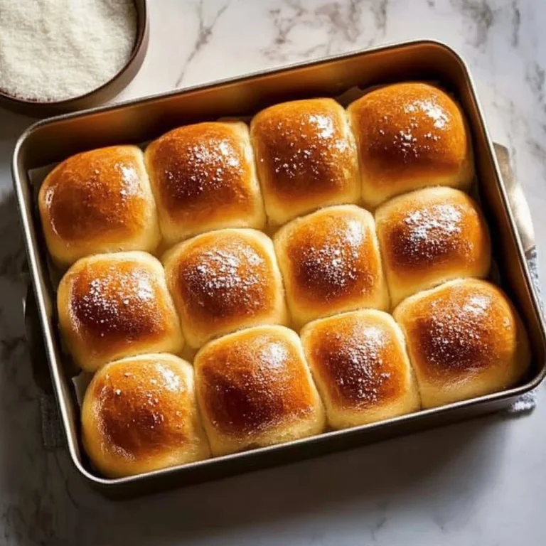 Fluffy homemade Thanksgiving rolls on a festive table setting.