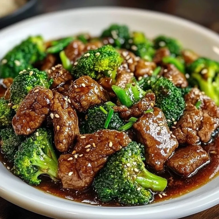 A plate of Chinese beef and broccoli served with rice.