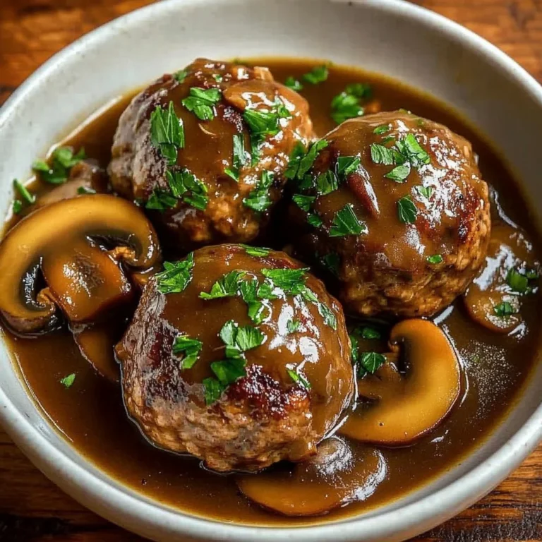 Juicy Bobby Flay Salisbury steak served with gravy and sides