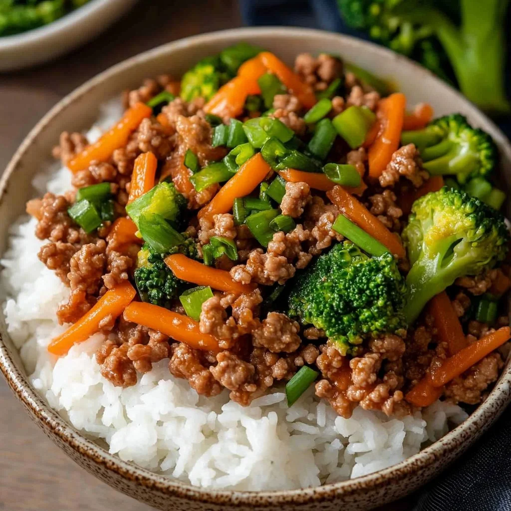 Plate of teriyaki ground turkey with broccoli served in a bowl