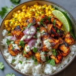 Easy street corn chicken rice bowl with vibrant toppings and rice