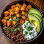 Delicious Ground Beef Hot Honey Bowl garnished with fresh herbs and honey drizzle