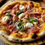 White pizza topped with prosciutto and drizzled with hot honey